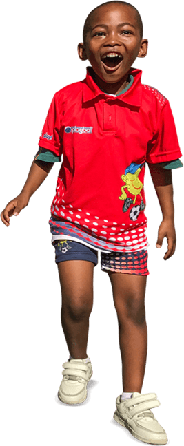 Playball kid laughing mid-run in a red Playball jersey