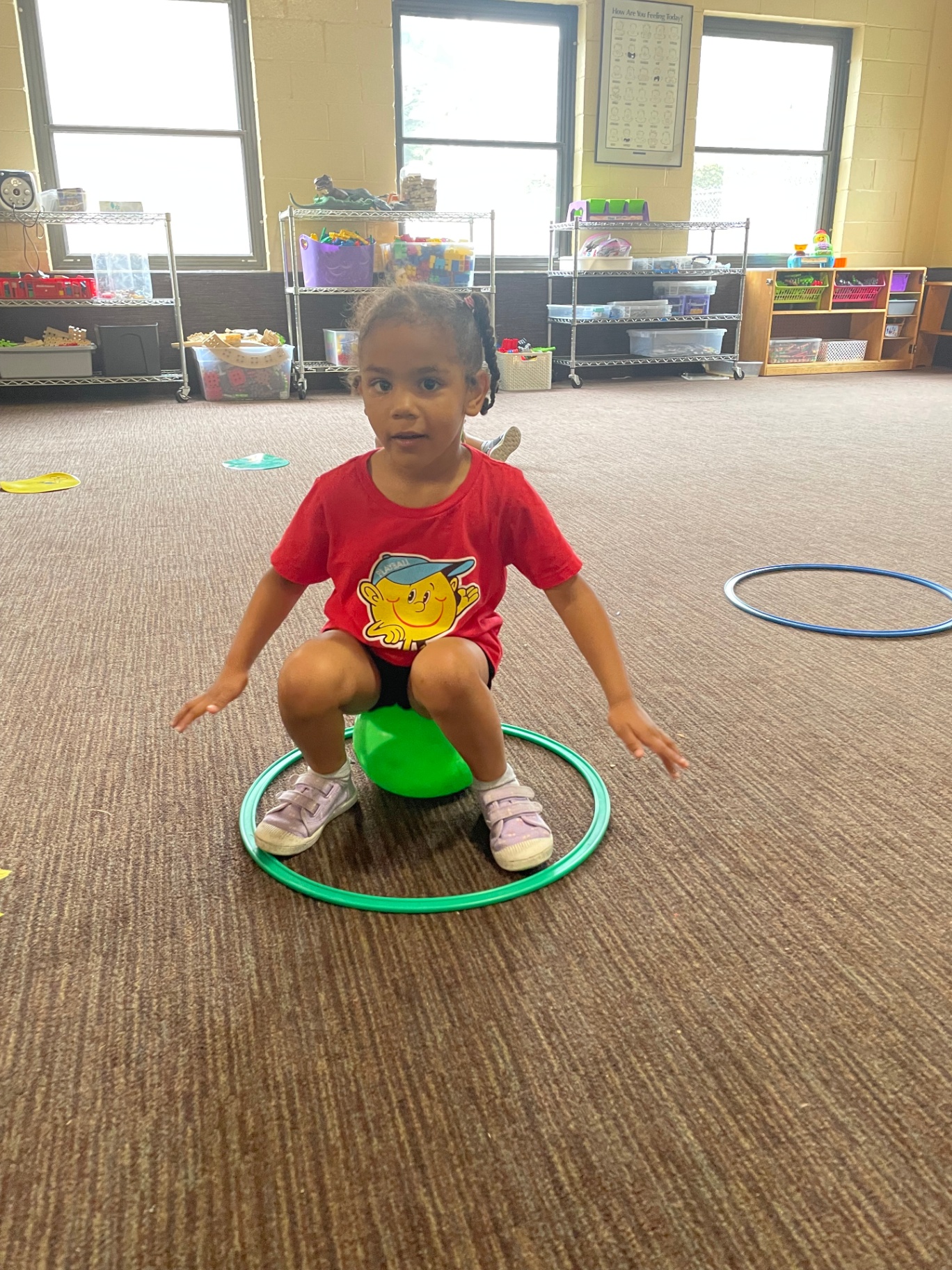 Young athlete balancing in a hoop drill