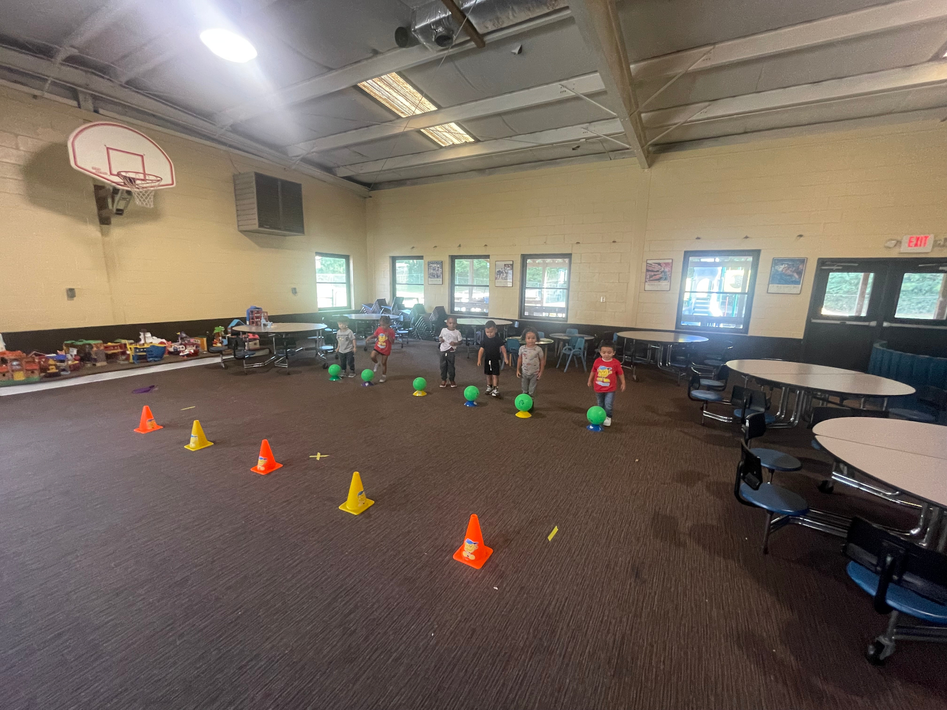 Kids working through a cones and balls drill